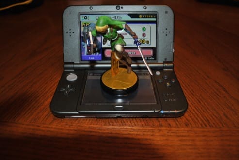 The NFC Reader is under the lower screen. Amiibos work in Smash, with Xenoblade Chronicles 3D confirmed to have support for the Shulk Amiibo.
