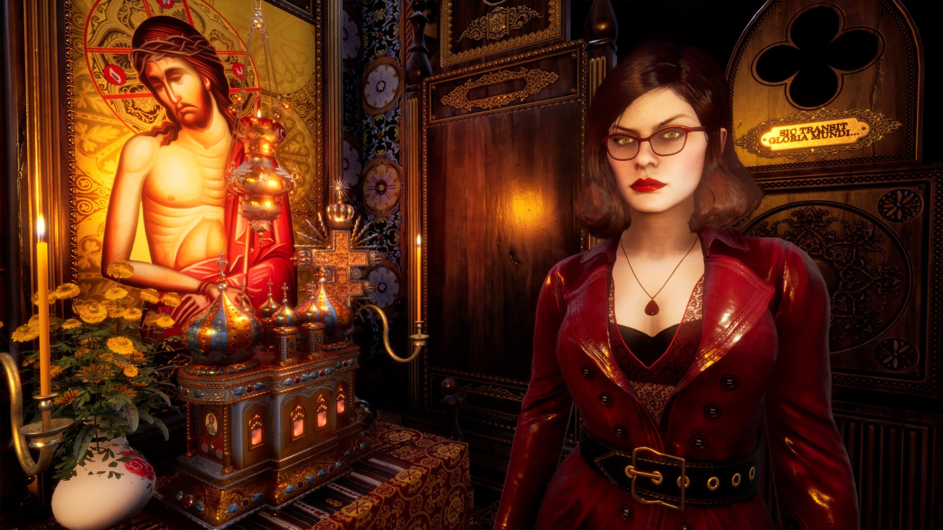 A woman in her 30s with short brown hair and glasses wearing a low cut red dress stands inside an orthodox christian chapel, next to her is a shrine to a saint with votive candle illuminating a small portrait. 
