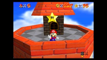 Mario at the top of a tower, flashing a V for victory pose