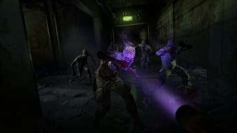The player aiming an ultraviolet torch at zombies in Dying Light 2