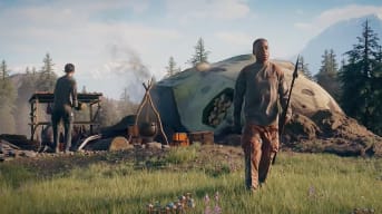 Stranded Alien Dawn Gameplay image where the main character stands in an open field next to what looks to be his hut, holding a spear and looking off into the distance