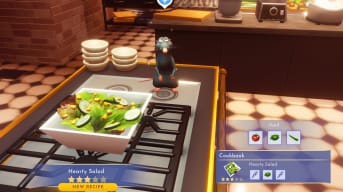 Screenshot of Remy's kitchen from the movie in game, while cooking a hearty salad recipe, Disney Dreamlight Valley Remy Guide
