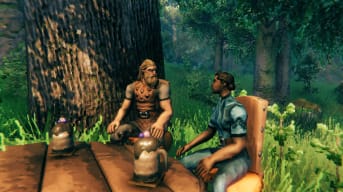 Two characters sitting at a table and looking at each other in the Valheim Mistlands update