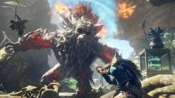 Wild Hearts release date screenshot showing off three players facing off against a huge monster.