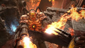 The player about to chainsaw a Mancubus in the face in Doom Eternal