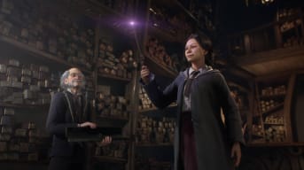 A student examining a wand as a wand seller looks on in Hogwarts Legacy