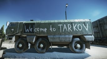 Escape from Tarkov screenshot showing a bus with the words "Welcome to Tarkov" 