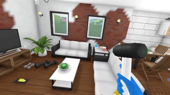 The player holding a hammer and looking at a work-in-progress room with splotches of paint in House Flipper VR
