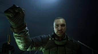 A screenshot of S.T.A.L.K.E.R. 2: Heart of Chornobyl showing a character holding a lucky charm