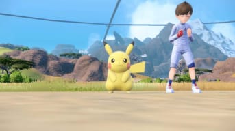 Pikachu smiling as a player concentrates while controlling it in the Pokemon Scarlet and Violet DLC The Indigo Disk