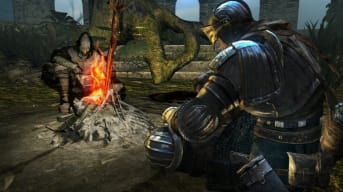 The player and a person can be seen by the campfire