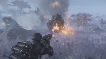 The player character firing a weapon at a Charger in Helldivers 2