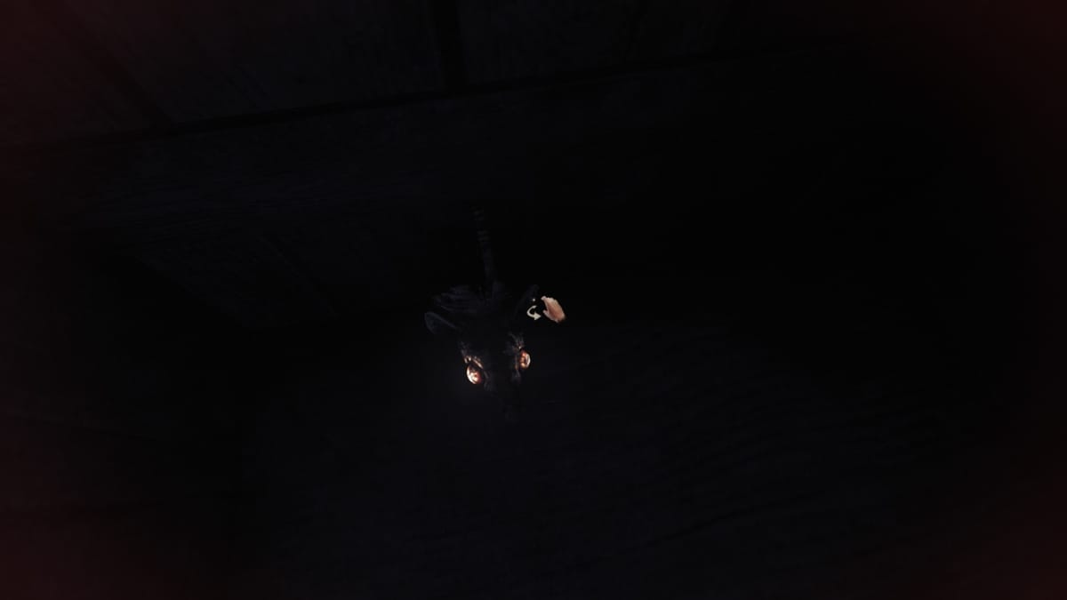 Amnesia: The Bunker screenshot showing a rat appearing to phase through a wooden cupboard door. 