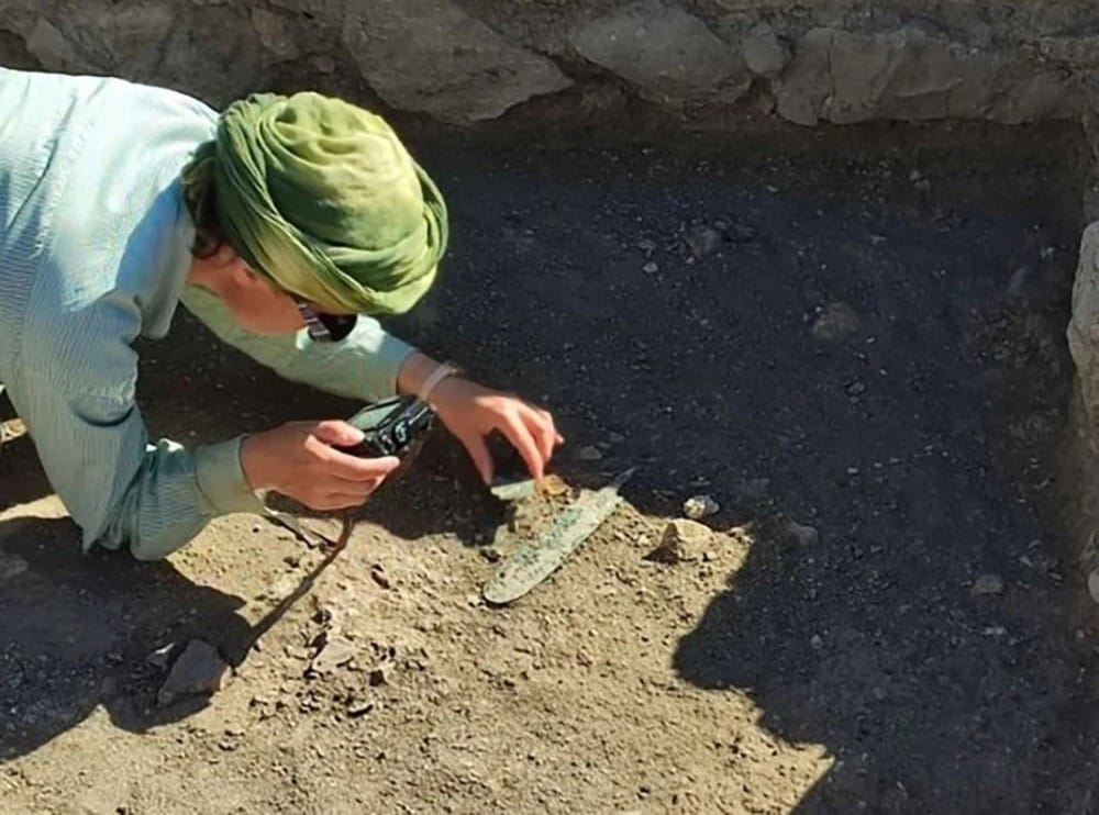 An archeologist discovering the remains of copper in Oman