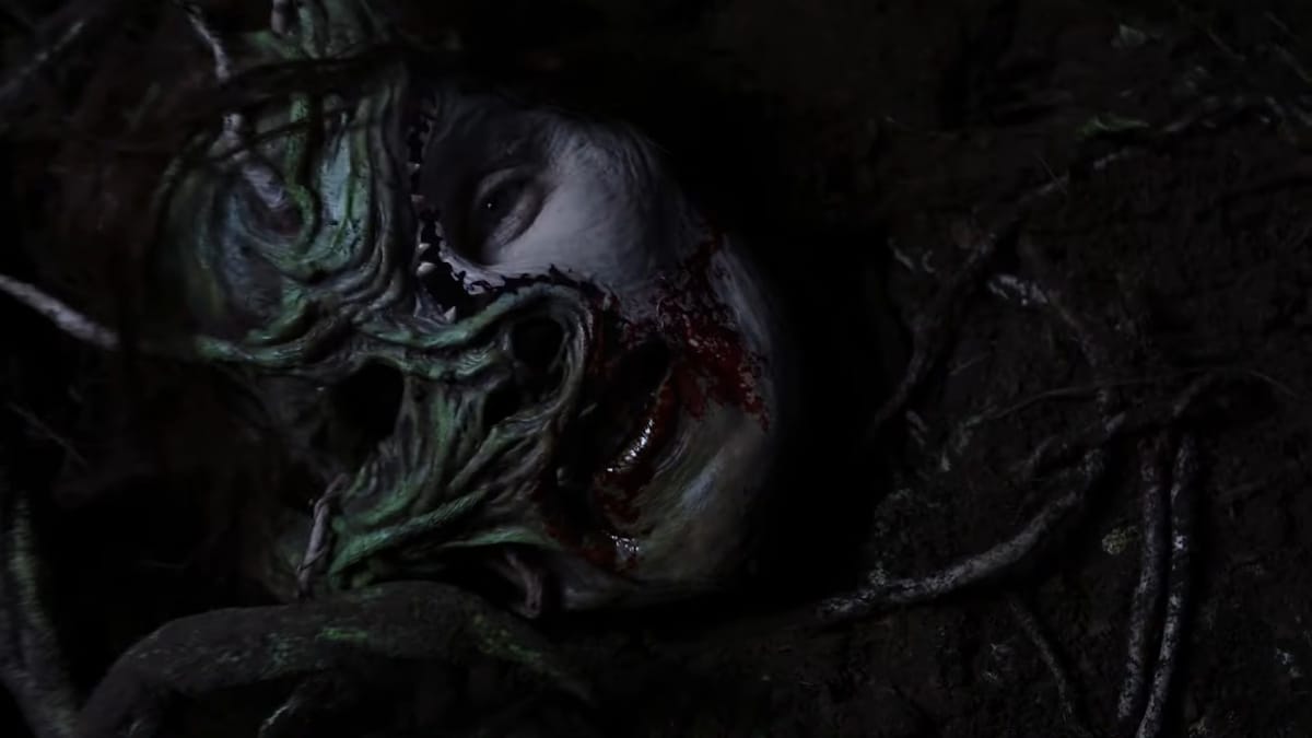 Creepshow video game screenshot showing a horrific visual of a face getting split by teeth