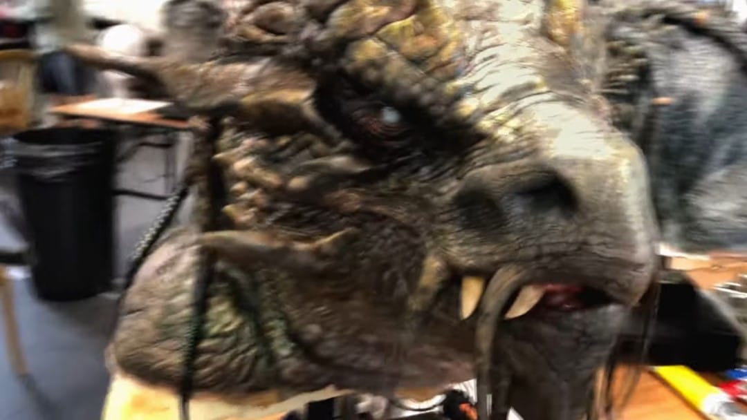 A screenshot of an animatronic dragon puppet from D&D Honor Among Thieves