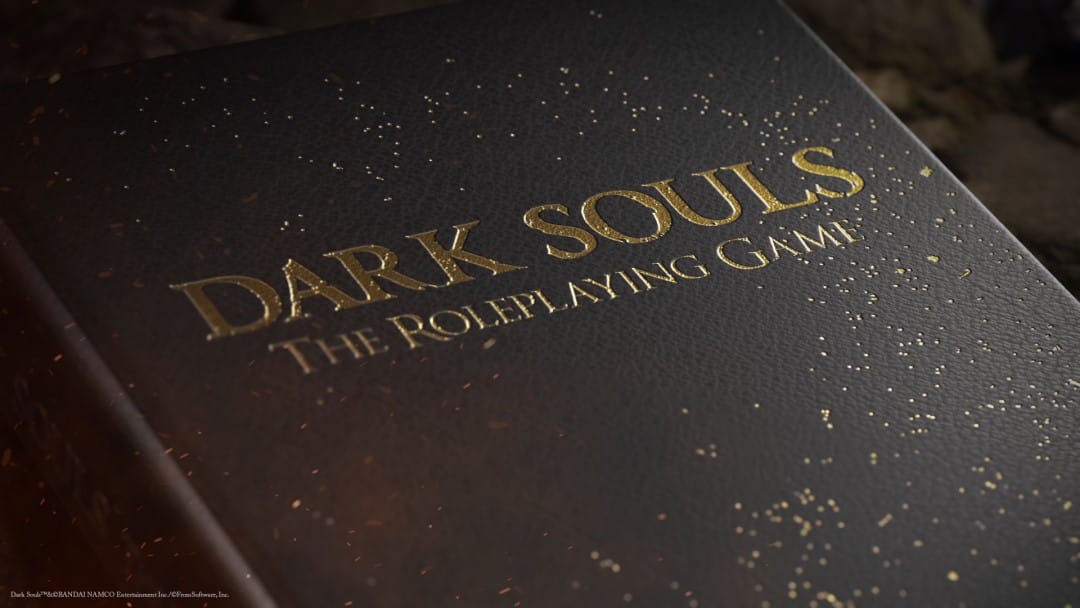 A closer look at the faux leather and gold foil cover of the Dark Souls tabletop RPG Collector's Edition
