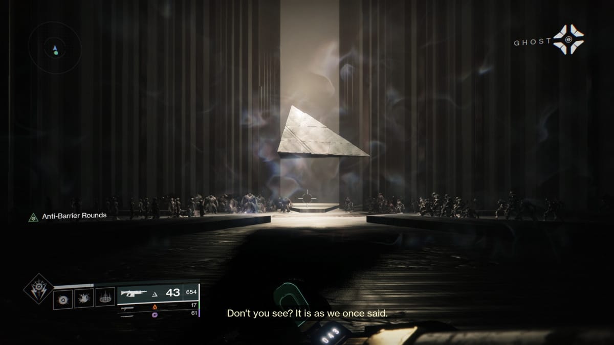 A pyramid floating in an stark hall with shadowy creatures reaching out to it