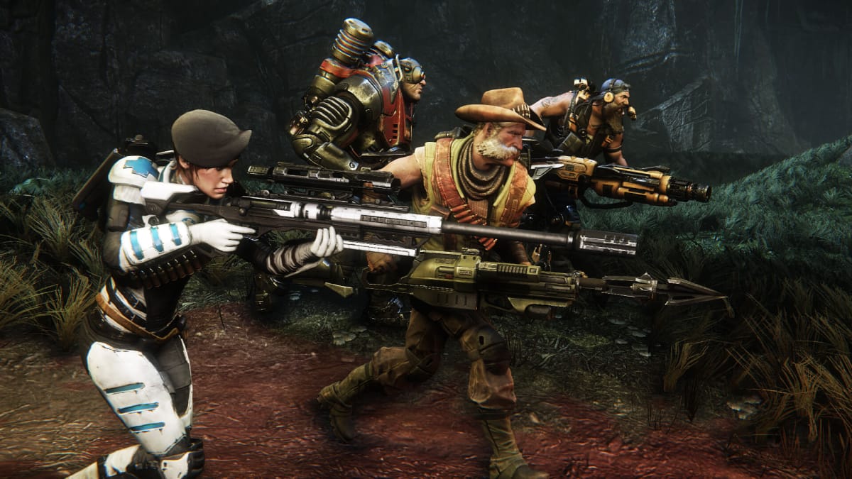 A squad of four players running through the jungle in Evolve