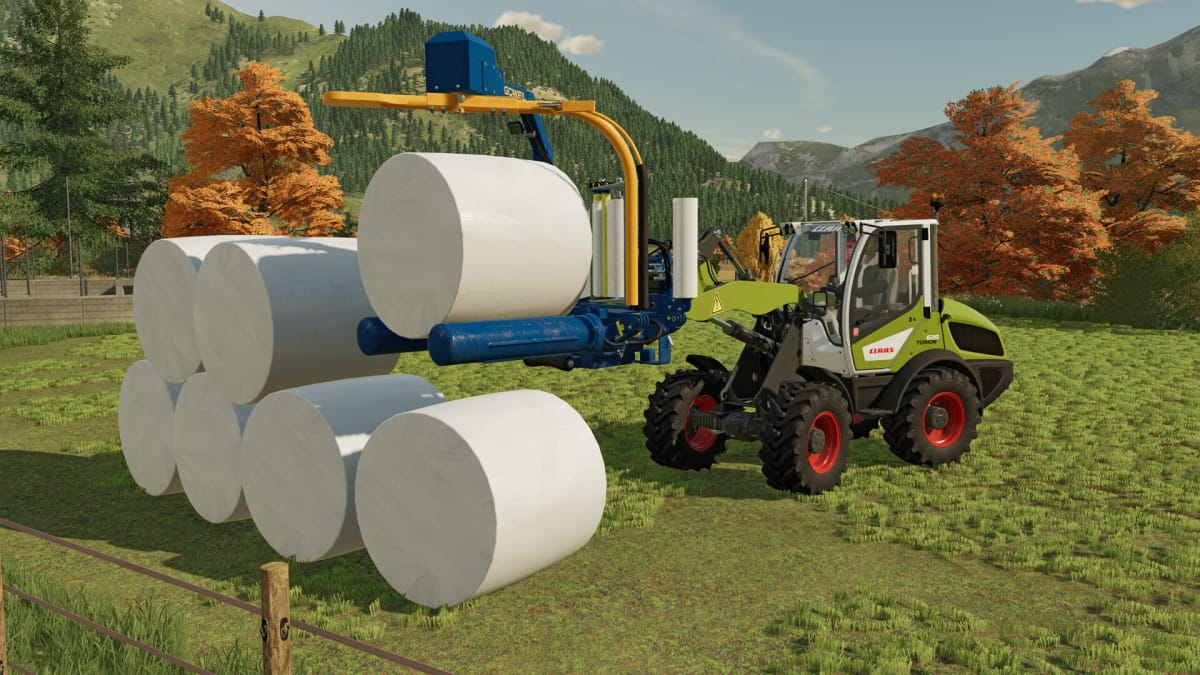 A machine moving bales around in the new Farming Simulator 22 DLC