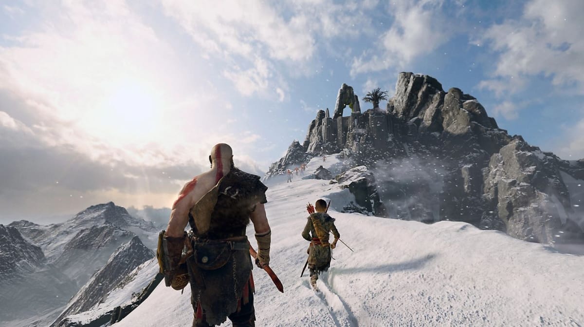 Should I buy a PC - Kratos and Atreus climb a mountain in God of War 