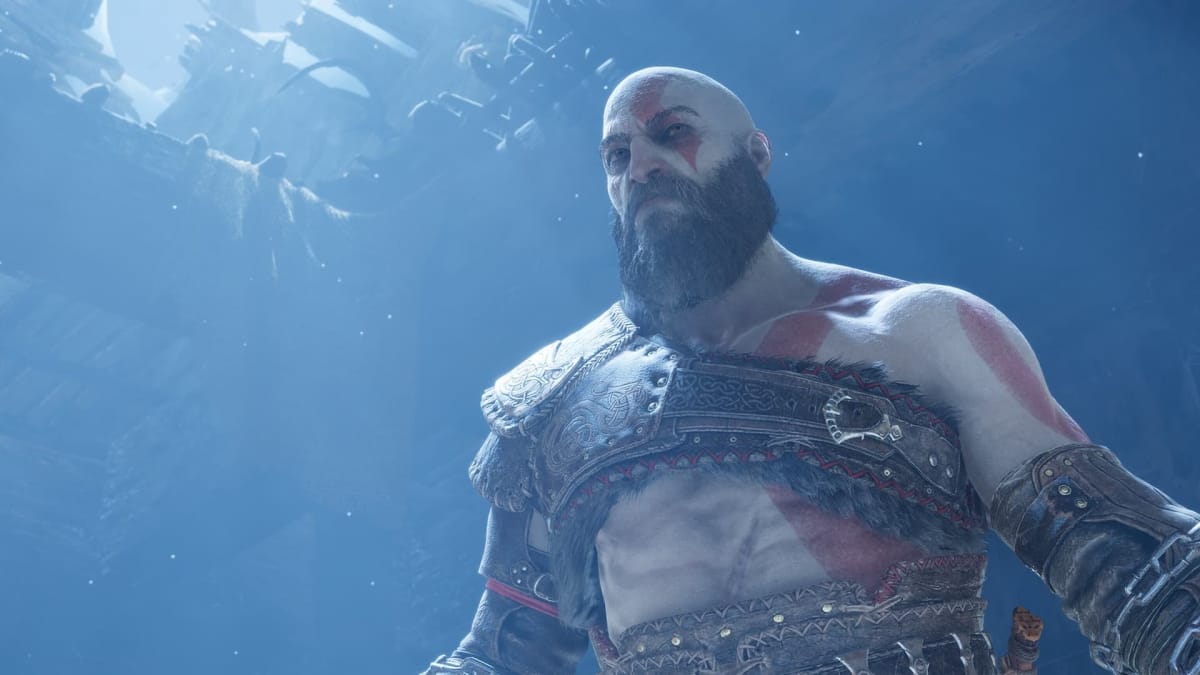 God of war Ragnarok photo mode screenshot from the playstation blog of Kratos standing menacingly in a dimly blue lit area