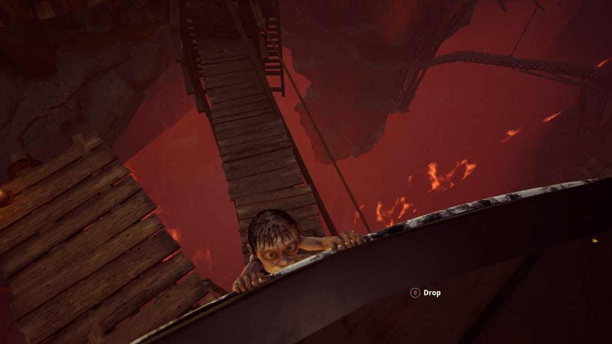 Gollum screenshot showing gollum hanging on the edge of a spinning wheel with various walkways and catwalks waiting below. 
