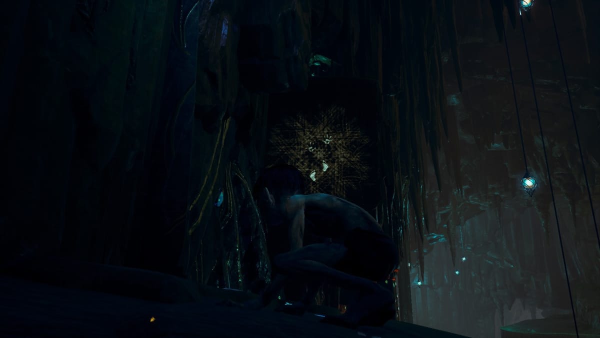 Gollum screenshot showing Gollum crouched in a wet cavern with a nearby mark on the wall showing various scratches and hand/foot prints. 