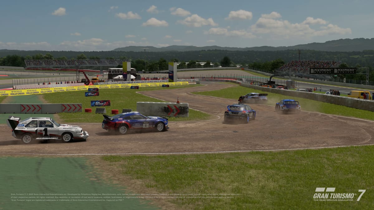 Five cars racing around a dirt track in Gran Turismo 7