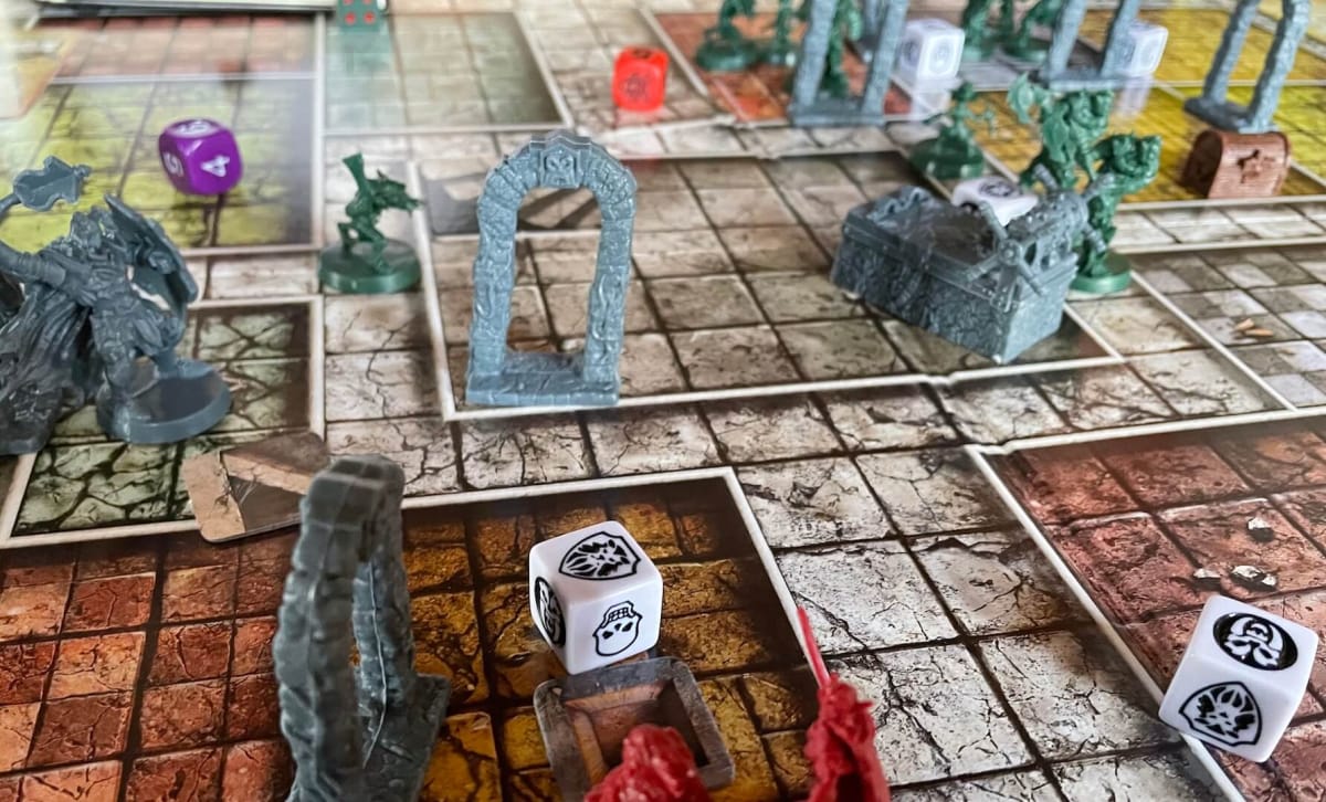Dice are rolled for attacks and defense as rooms are explored in HeroQuest