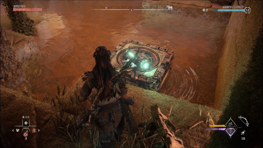 Aloy putting a charged cell on a crate in a shallow pool