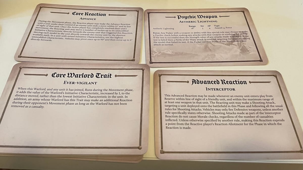 Horus Heresy Reference Cards displayed on a table