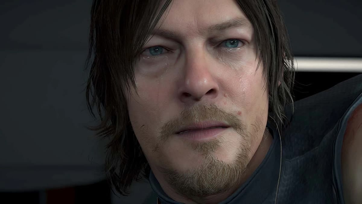 Image of the main character from Death Stranding looking at the camera in game as he cries