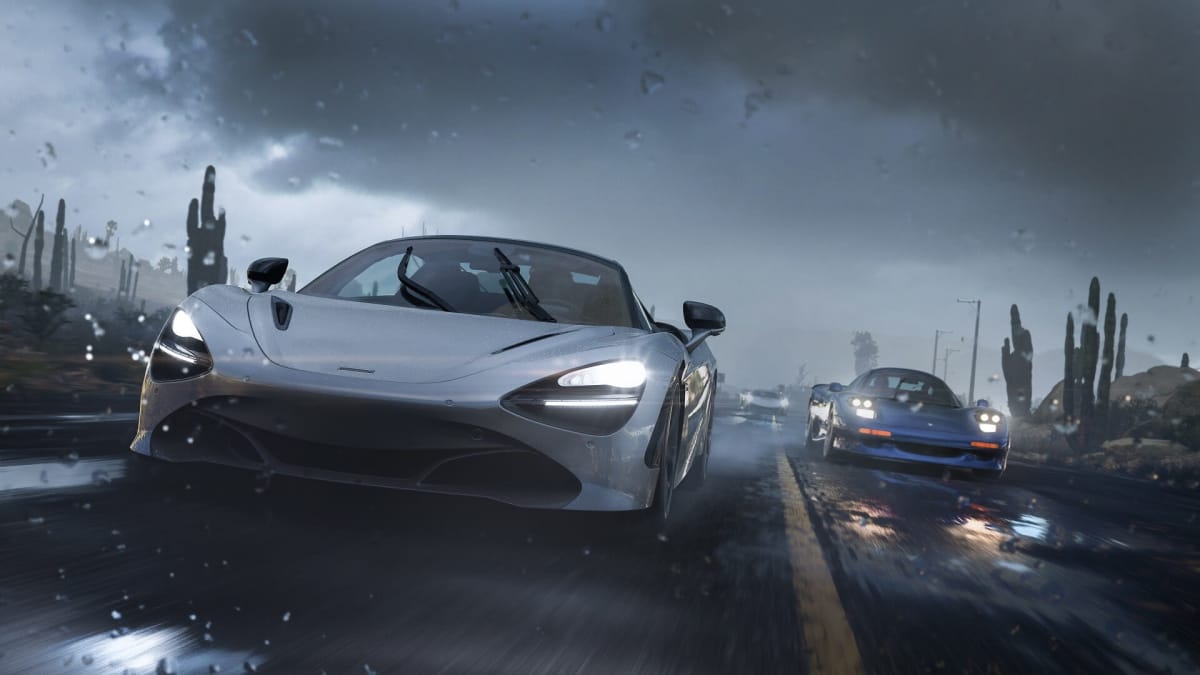 Two cars racing on a rain-slicked road in Forza Horizon 5, some of the staff of which have founded Maverick Games