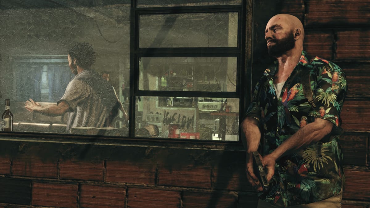 Max takes cover behind a wall in Max Payne 3