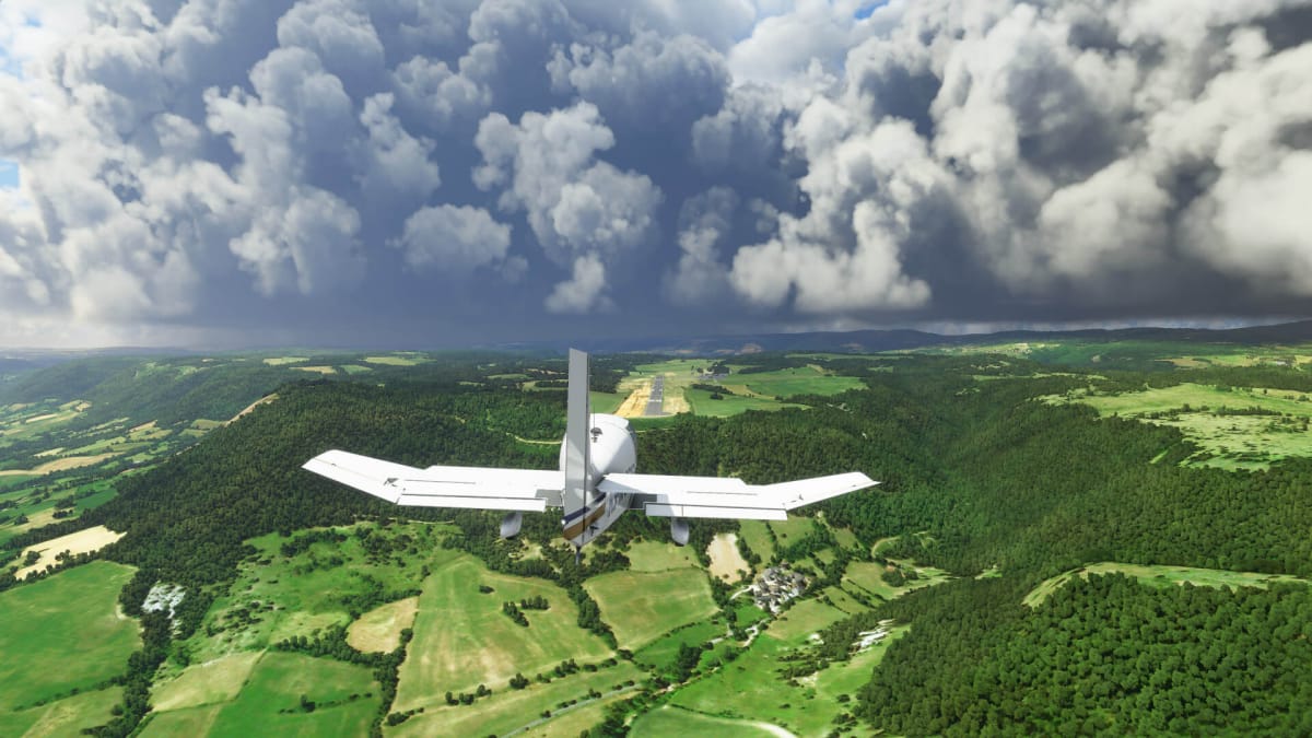 An aircraft flying over a picturesque village in Microsoft Flight Simulator