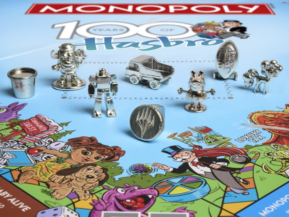 A screenshot of the board from Monopoly: Hasbro 100th Anniversary Edition, featuring pieces from Transformers, Nerg, Peppa Pig, Tonka, My Little Pony, and more.