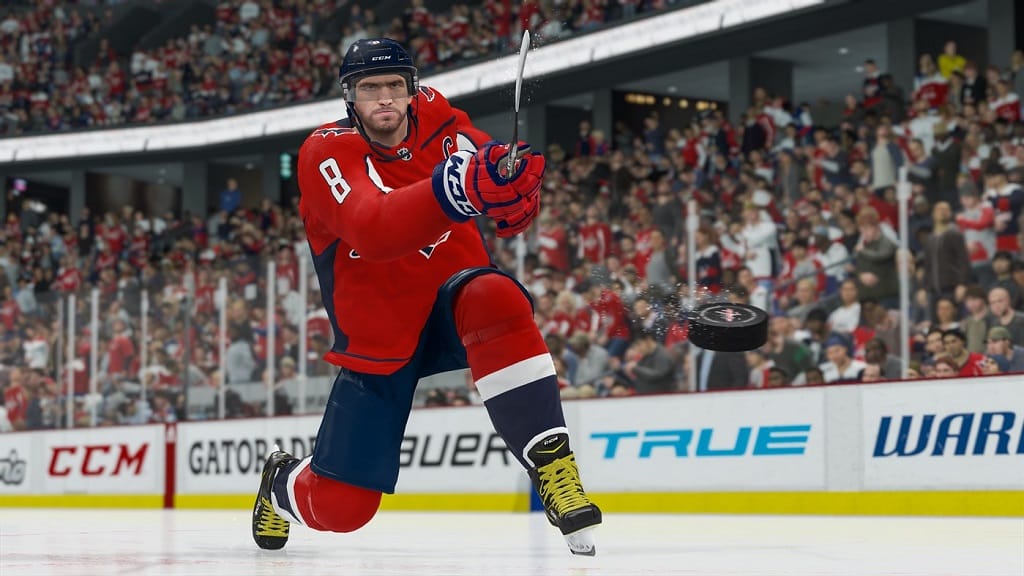 A player hitting the puck in NHL 21 on Xbox Game Pass