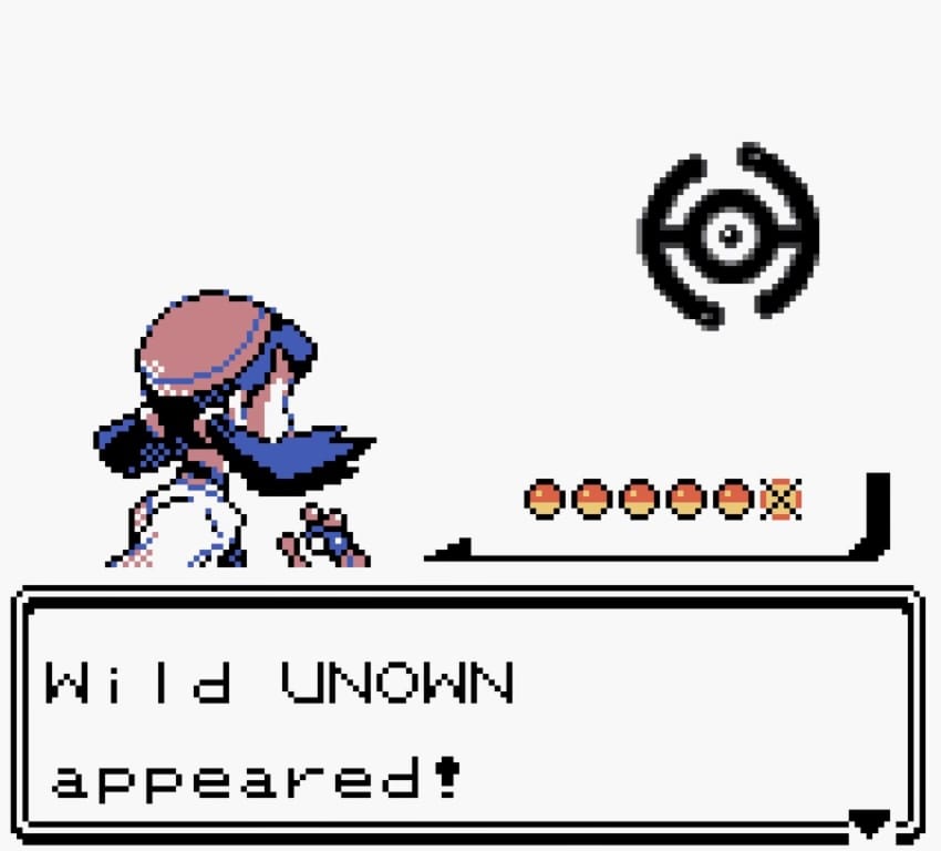 Pokemon Trainer Kris in a wild encounter with an Unown