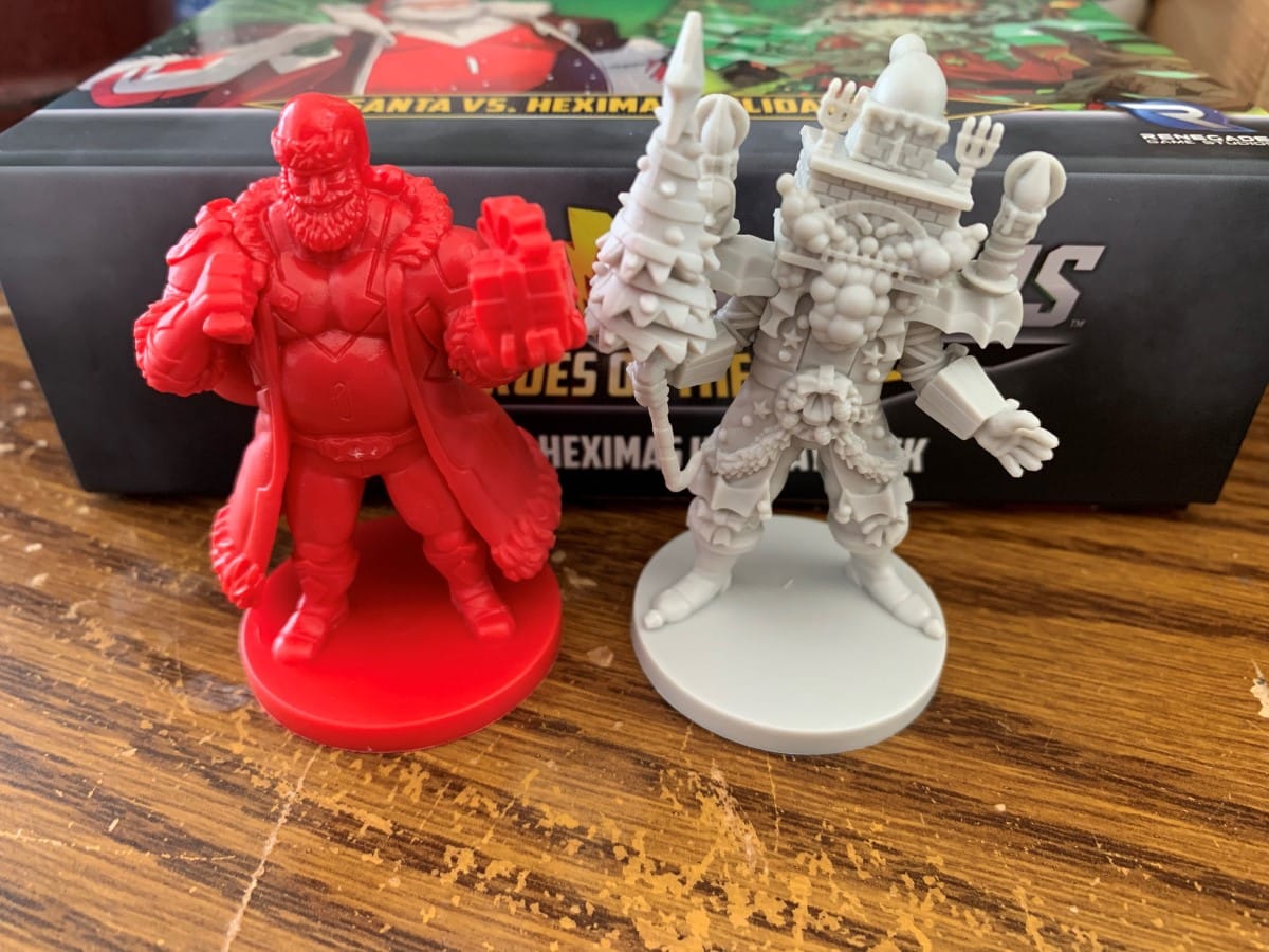 A close up of Santa Claus and Heximas' figures from Power Rangers: Heroes of the Grid