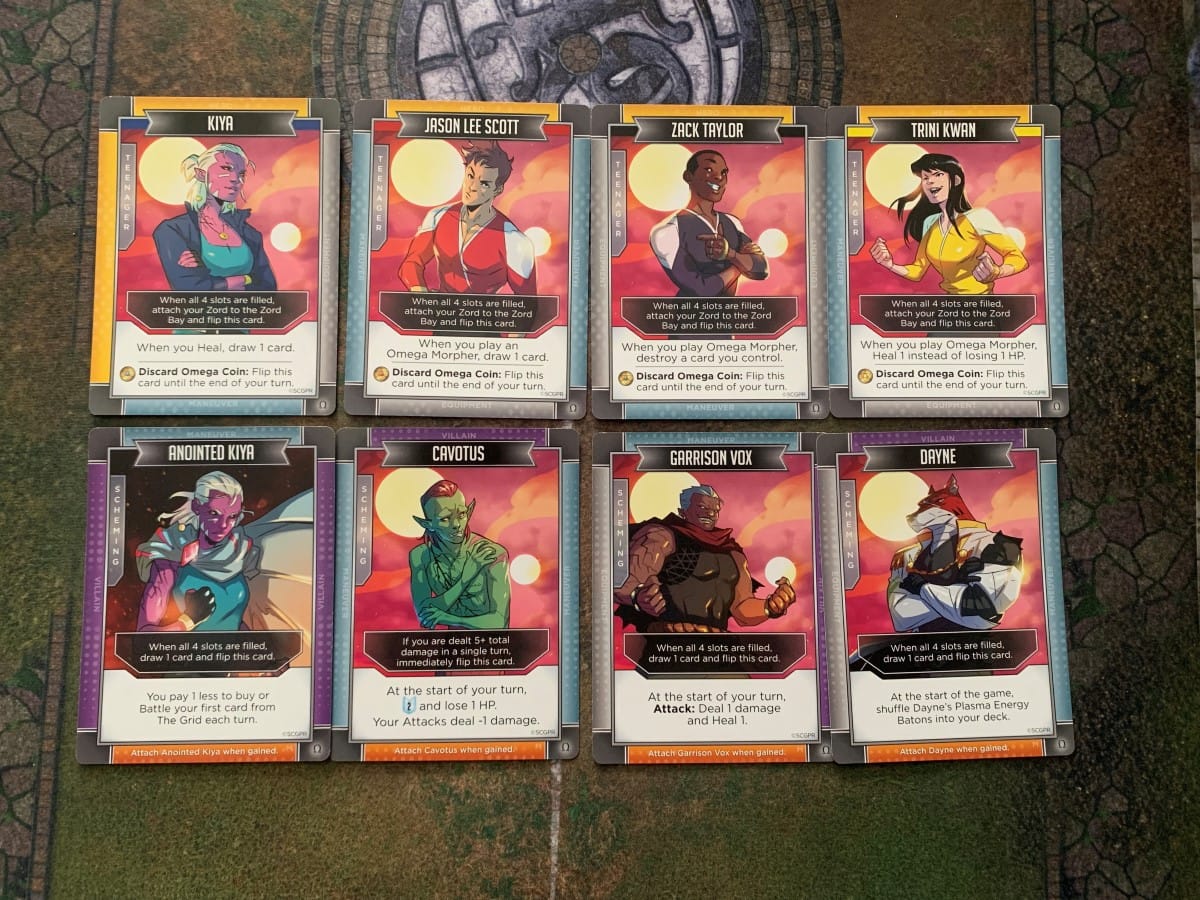 Power Rangers Omega Forever character cards on a gaming table