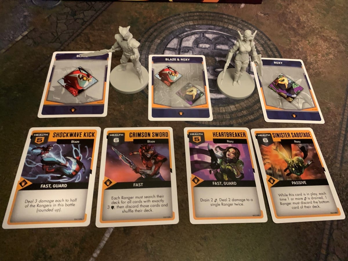The cards and miniatures for Roxy and Blaze from Rangers United