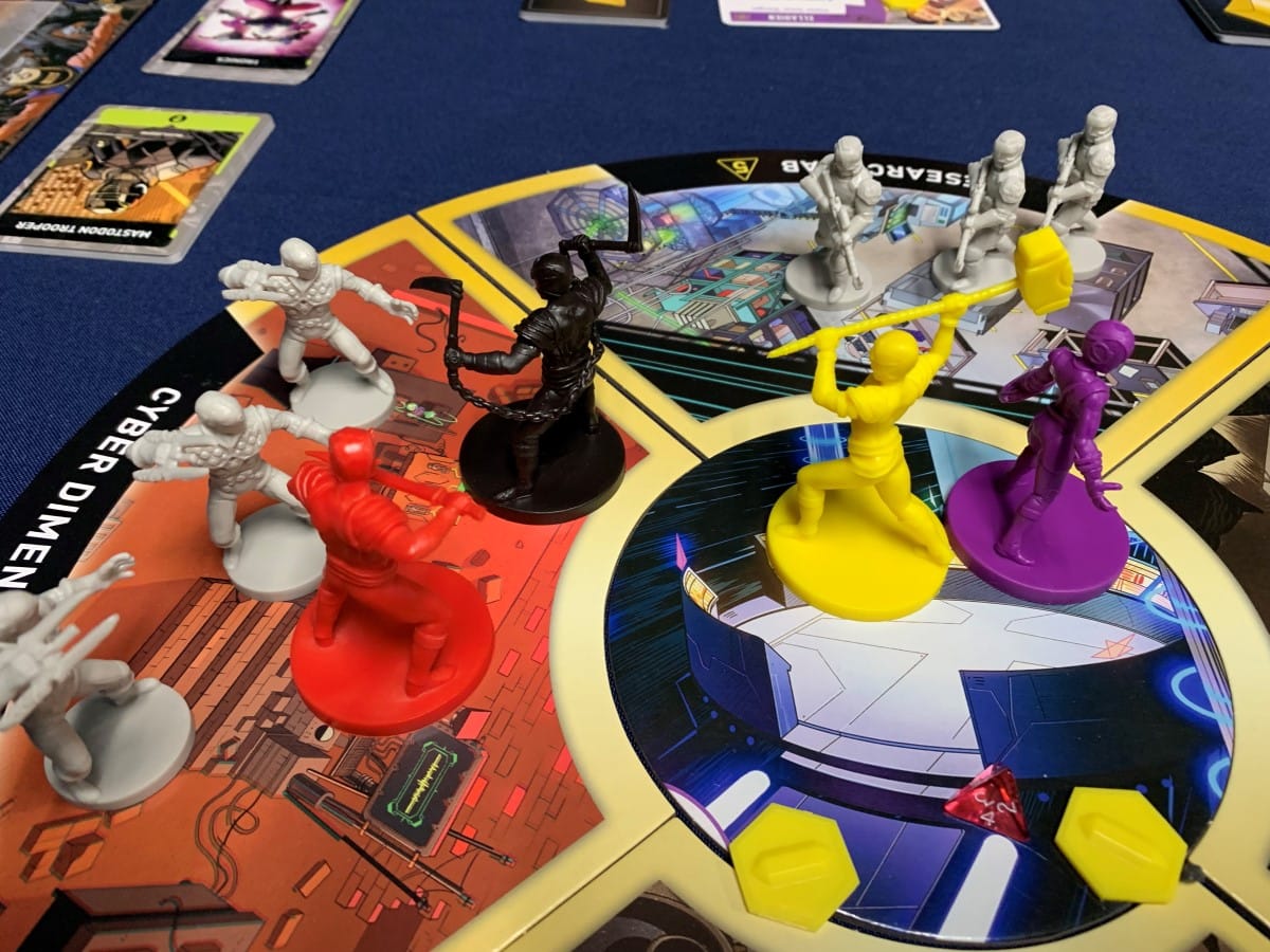 The Omega Rangers fighting tronics and mastodon troopers on a game board
