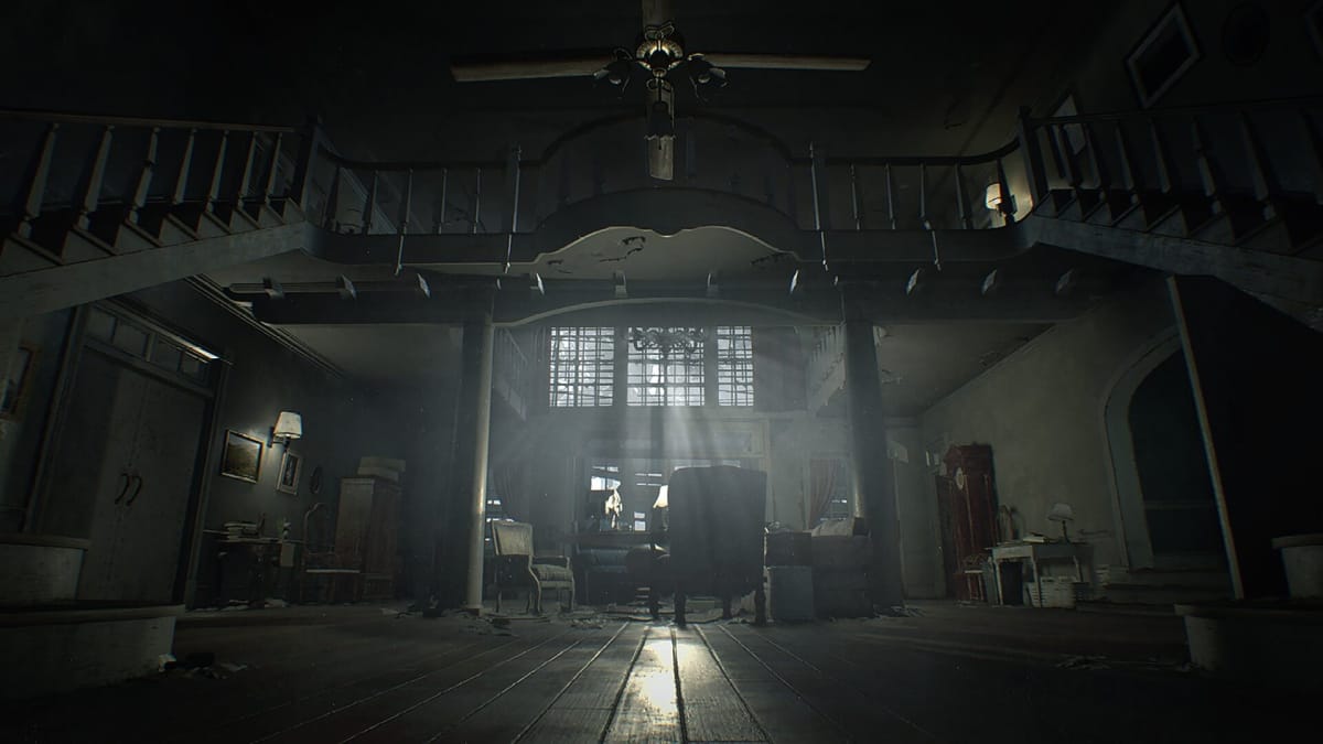 A gloomy shot of the Baker mansion, with light streaming in through the windows, in Resident Evil 7