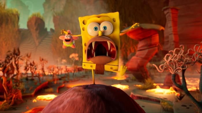 SpongeBob SquarePants The Cosmic Shake Gameplay Trailer, Screenshot of SpongeGar in game mouth wide open with fangs showing in a volcanic looking setting and Patrick flying above him