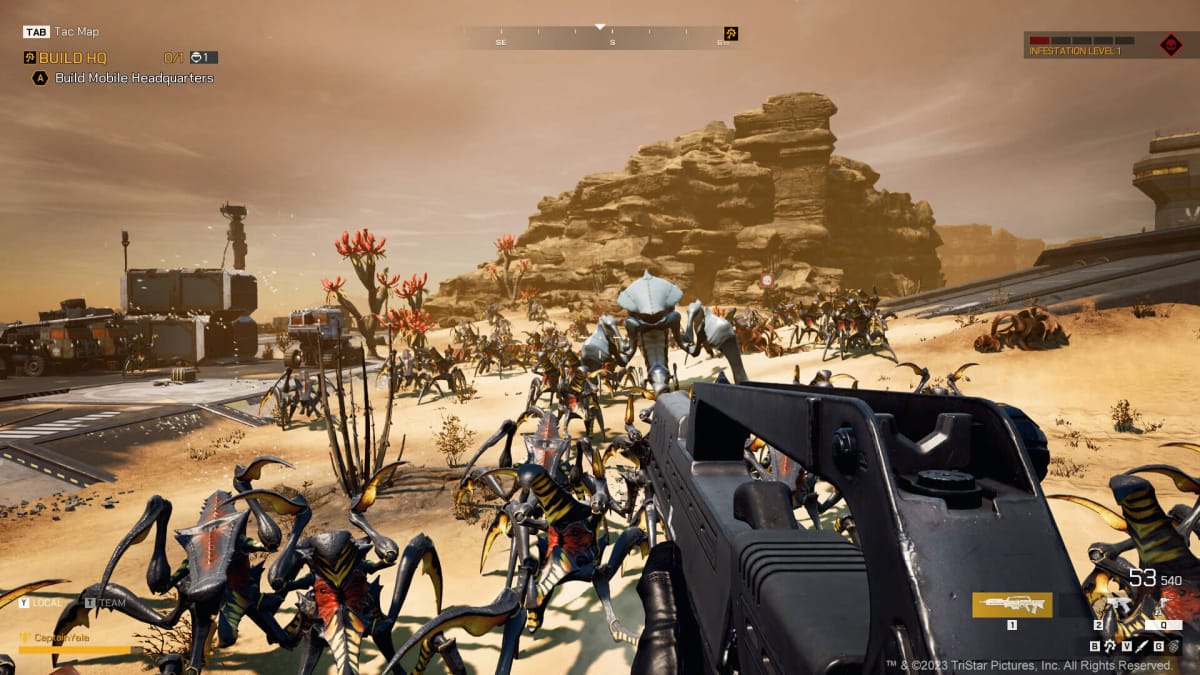 A trooper fighting off a massive wave of bugs in Starship Troopers: Extermination