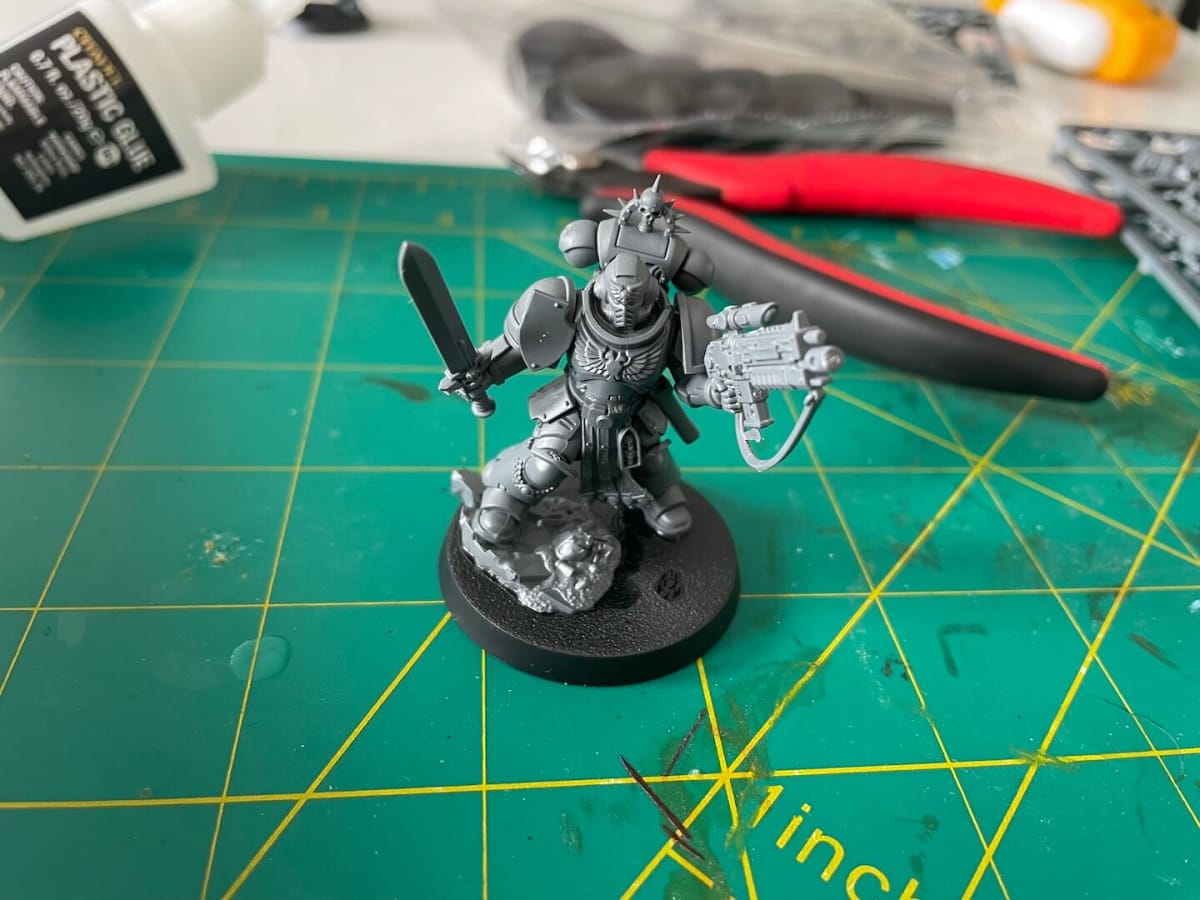An image of the Primaris Lieutenant built and unpainted, holding a power sword and rifle