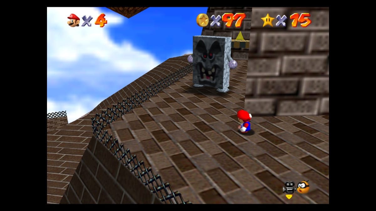 Mario turning to face a giant moving cinderblock with an angry face