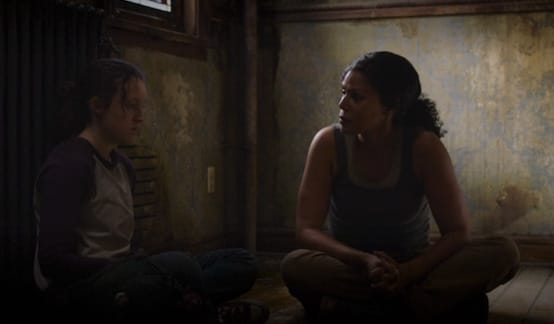 Ellie and Marlene sit together in a Firefly safehouse