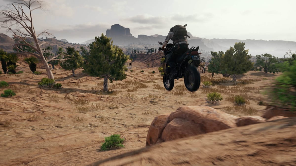 A player riding a motorbike in PUBG, which, thanks to the Taliban PUBG ban, won't be playable in Afghanistan for much longer